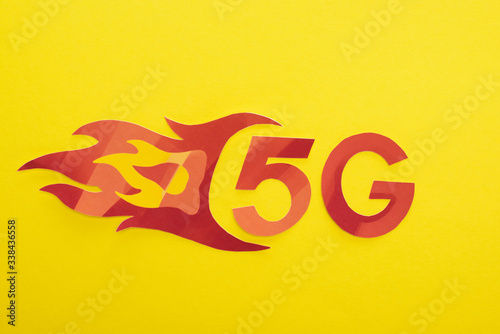 top view of red 5g with flame lettering on yellow background