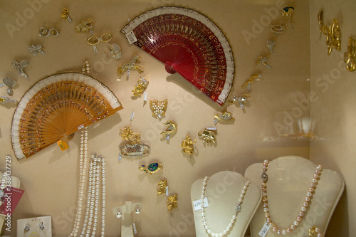 Fans and jewelry displayed in store window of Rome, Italy, Europe