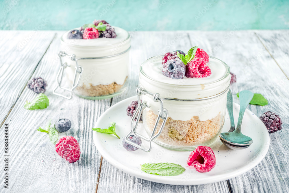 Cheesecake in portioned jars with summer berries Cheesecake in portioned jars with summer berries