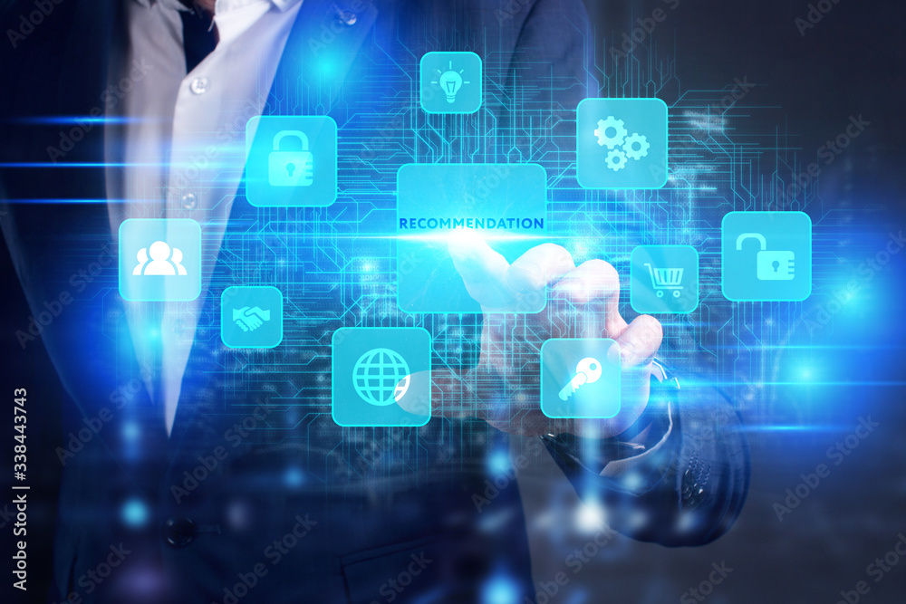 Business, Technology, Internet and network concept. Young businessman working on a virtual screen of the future and sees the inscription: Recommendation Business, Technology, Internet and network concept. Young businessman working on a virtual screen of the future and sees the inscription: Recommendation