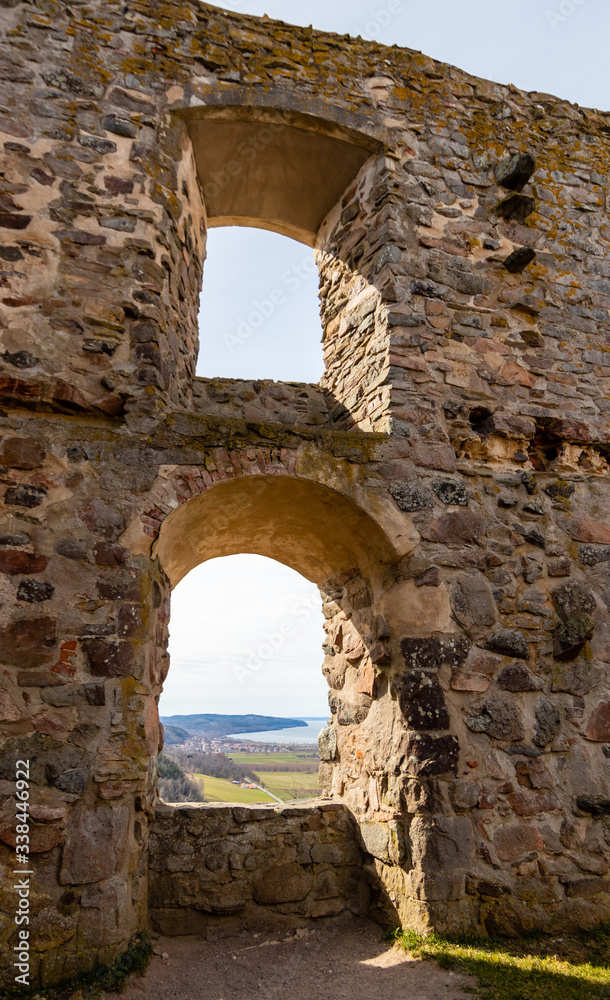 Ruins of the Brahehus Sweden. Free entry. Windows. Through the windows the village of Gränna on the shore of lake Vättern can be seen in the background.