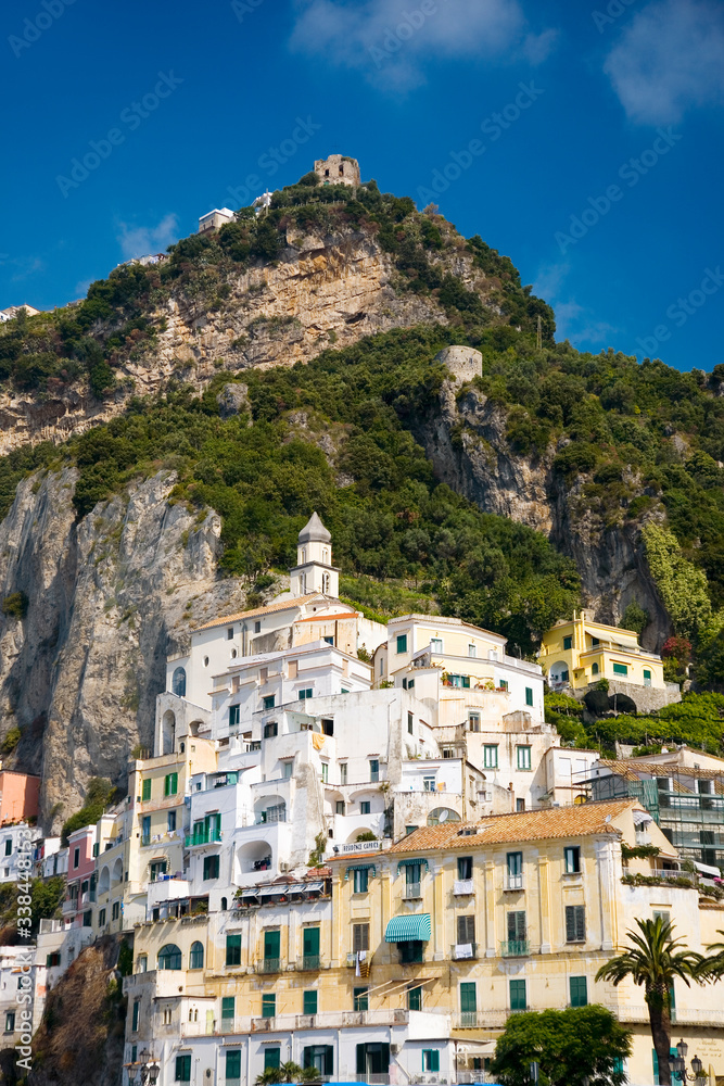 View of colorful buildings along seaside in Amalfi, a town in the province of Salerno, in the region of Campania, Italy, on the Gulf of Salerno, 24 miles southeast of Naples