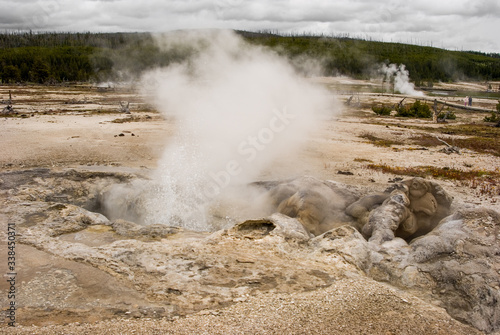 Avoca Spring steaming from superheated water in Yellowstone National Park