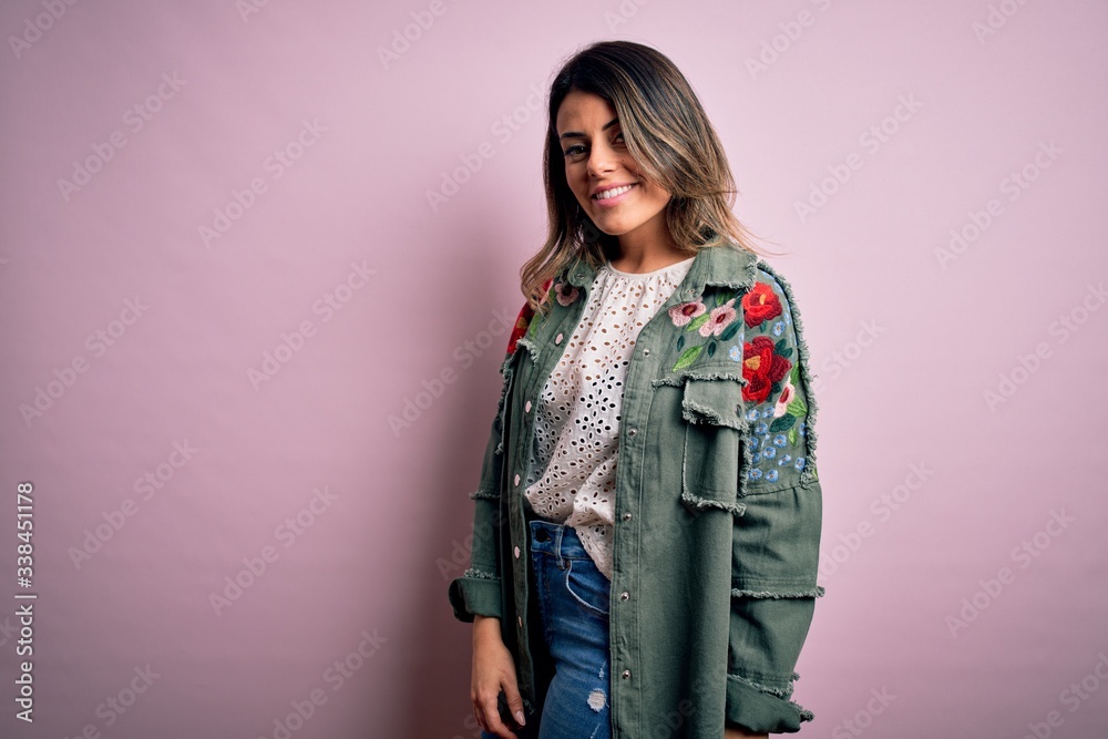 Young beautiful woman wearing fashion urban clothes, model wearing casual street style standing over pink background Young beautiful woman wearing fashion urban clothes, model wearing casual street style standing over pink background