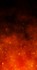 Fire embers particles over black background. Fire sparks background. Abstract dark glitter fire particle lights.