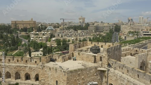 JERUSALEM, ISRAEL - MAY 18, 2016: View to the city new part and King David Hotel over the Tower of David western wall located near the Jaffa Gate entrance of the Old City.