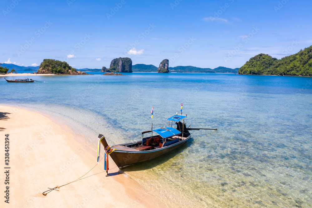 long tail boat on the sand beach long tail boat on the sand beach
