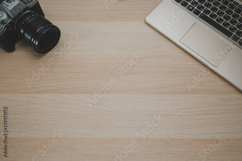 laptop and camera on desk