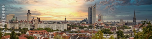 Panorama of the city of Leipzig, Saxony, with tall buildings, town hall and churches with an interesting colored sky © 2199_de
