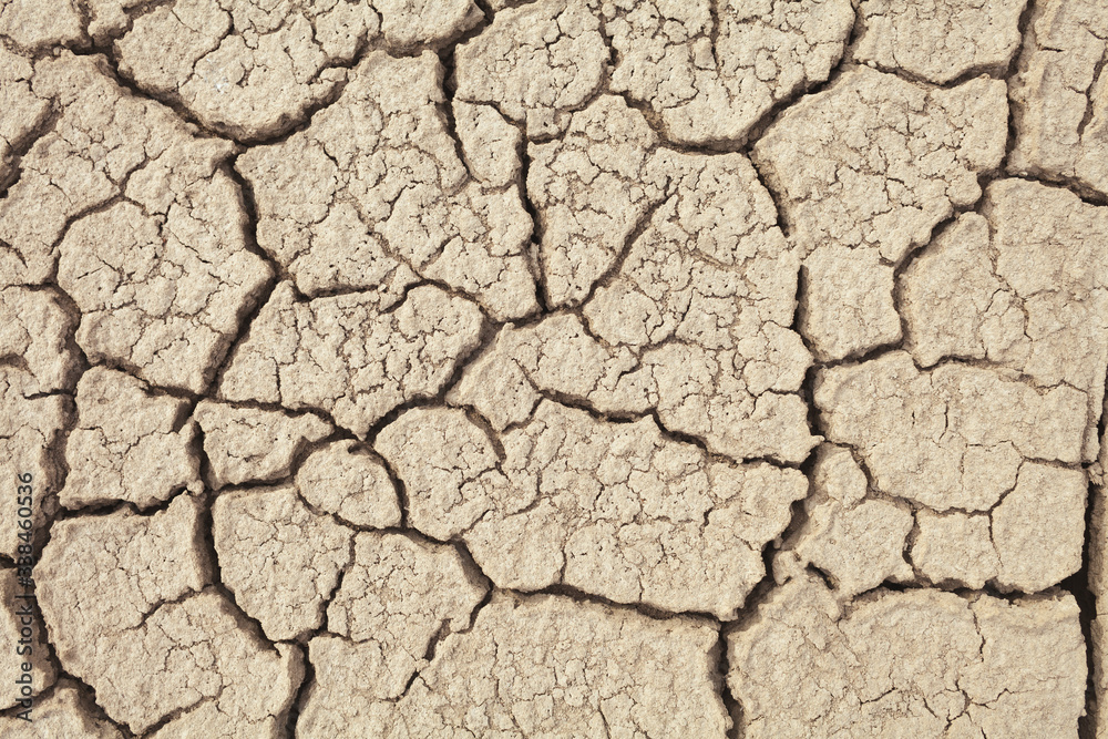 Cracks in the earth in rural areas. Ground texture background. Dry soil abstract photo. Mosaic pattern Cracks in the earth in rural areas. Ground texture background. Dry soil abstract photo. Mosaic pattern