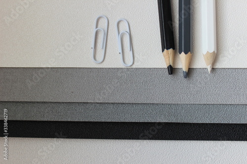 paper clip and pen on black and white shades concept