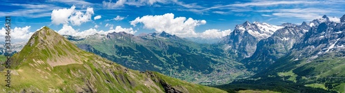 Fototapeta Naklejka Na Ścianę i Meble -  Switzerland, Panoramic view on Grindelwald valley and Wetterhorn and green Alps around
