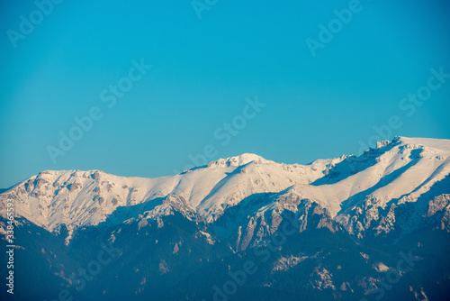 mountains full of snow and blue sky © florinfaur