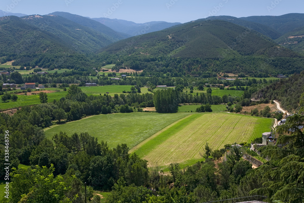 Green valley view of La Seu d'Urgell, (Sa Seu d'Urgell) in Catalunya, Spain, Europe, in Pyrenees Mountains