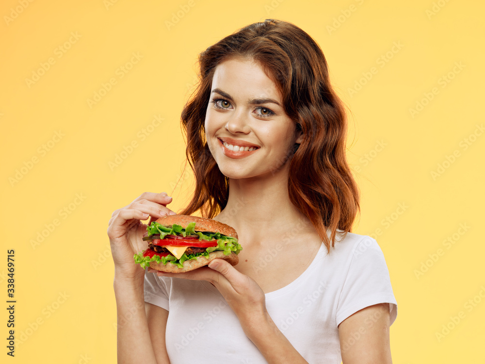 young woman holding a bowl of salad young woman holding a bowl of salad