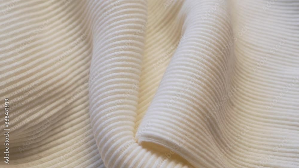 Macro Detailed Texture of Woolen with Silk Soft Beige Fabric Material. Textile Abstract Background. Concept Of The Garment Industry. Macro Detailed Texture of Woolen with Silk Soft Beige Fabric Material. Textile Abstract Background. Concept Of The Garment Industry.