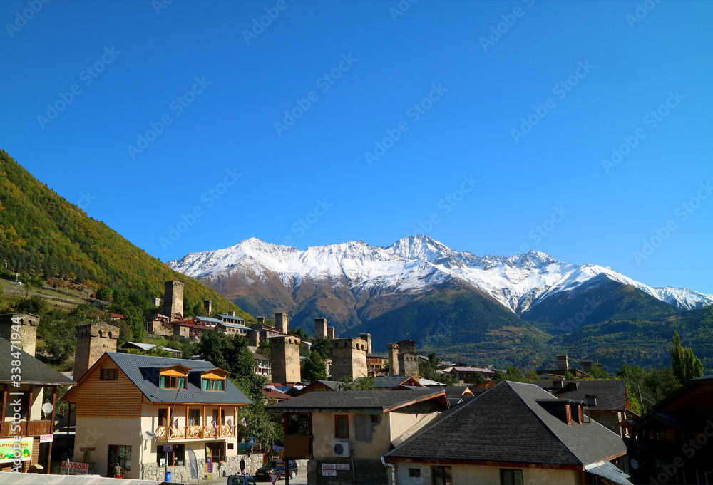 Impressive Scenery of Group of Medieval Svan Tower-houses in Mestia Town with Snow-capped Caucasus Mountains in the Backdrop, Svaneti Region, Georgia