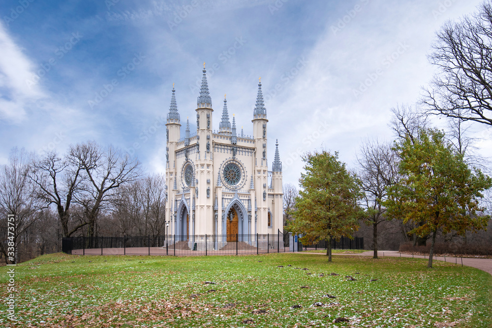 Gothic chapel in Peterhof, Russia or the church of Holy Blessed Grand Duke Alexander Nevsky. Sculptures adorning the facade of the building. Alexandria park near Saint Petersburg.