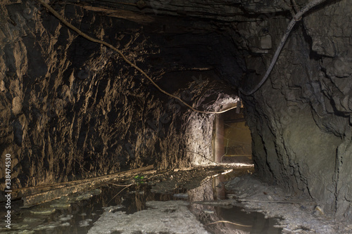 Underground old abandoned iron mine tunnel