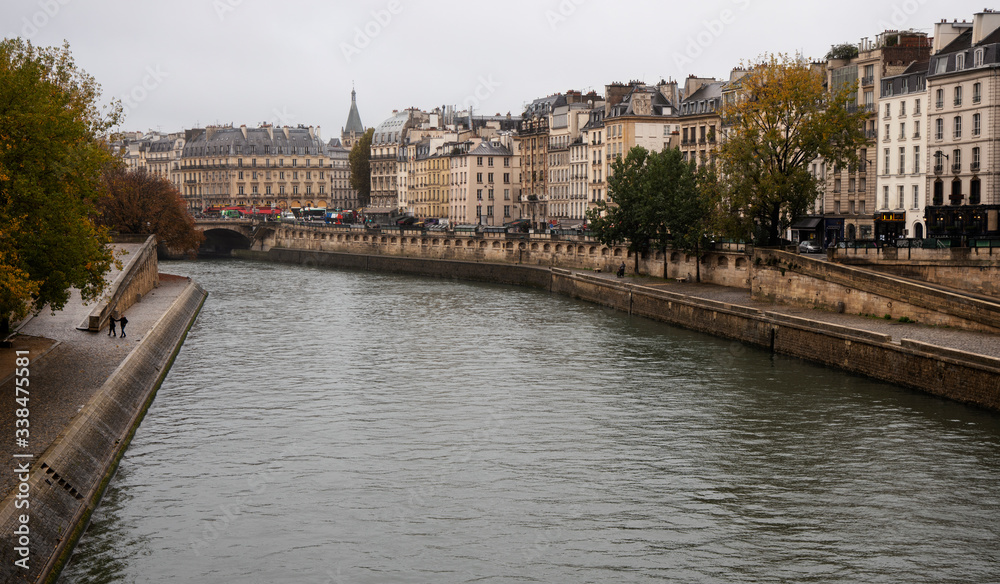 Paris. Seine River Embankment in Autumn Day