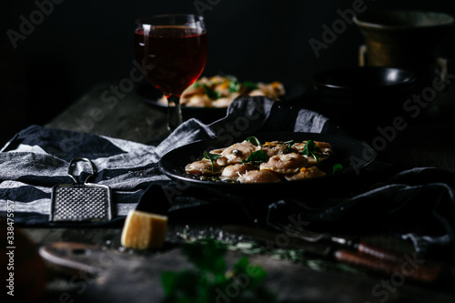 Ravioli with pumpkin and cheese on a dark background © elenavah