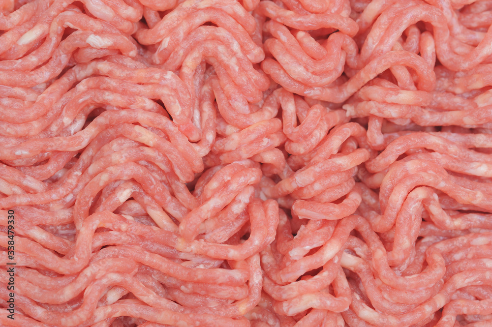 Raw and red mincemeat close up with white fat spots in it Raw and red mincemeat close up with white fat spots in it