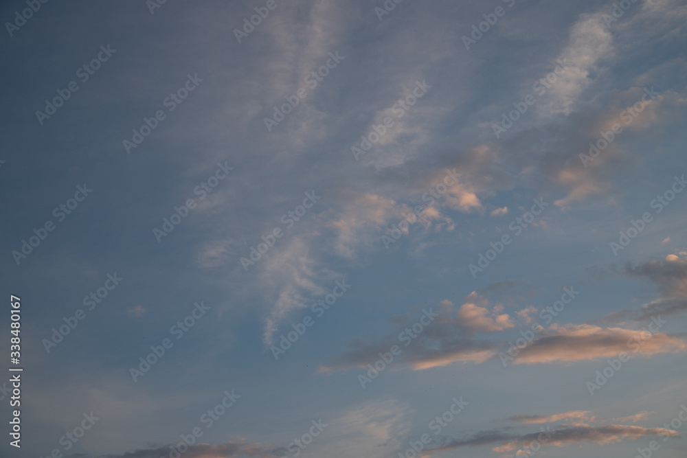 A cloudy sky on an sunny day at about sunset. The clouds are backlit in white an orange
A cloudy sky on an sunny day at about sunset. The clouds are backlit in white an orange