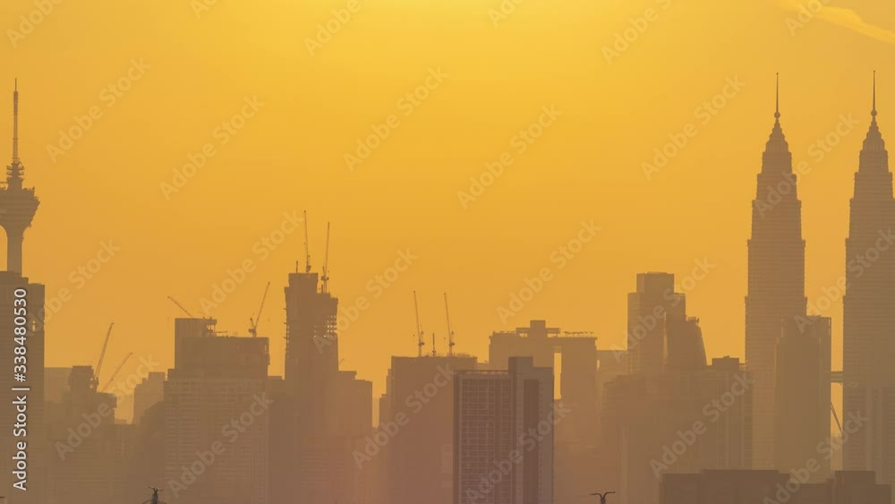 4K time lapse of majestic sunset over down town Kuala Lumpur, Malaysia.