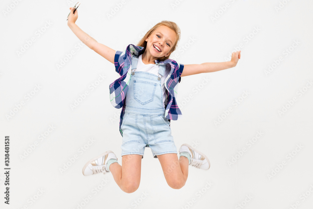 happy european girl jumping on a white background happy european girl jumping on a white background