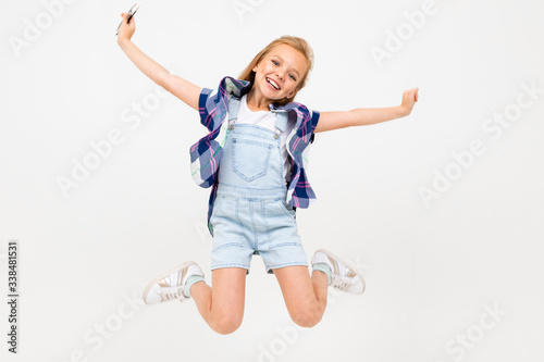 happy european girl jumping on a white background