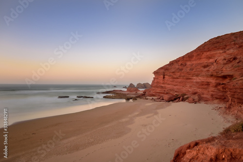 Landscape of Legzira Beach with its natural arches at the coast of Atlantic ocean. Legzira Beach is located on the ocean coast of Morocco, in Sidi Ifni, close to Agadir. © martinscphoto