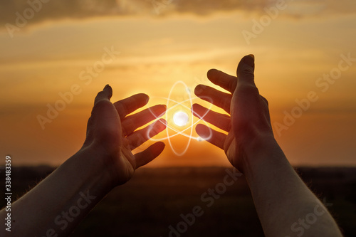 Hands shows a peaceful atom .