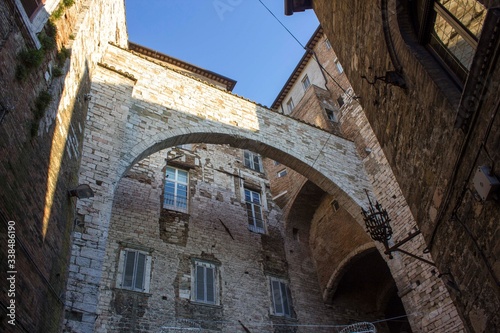 ancient historic arch between houses in the medieval part of Perugia city, Italy