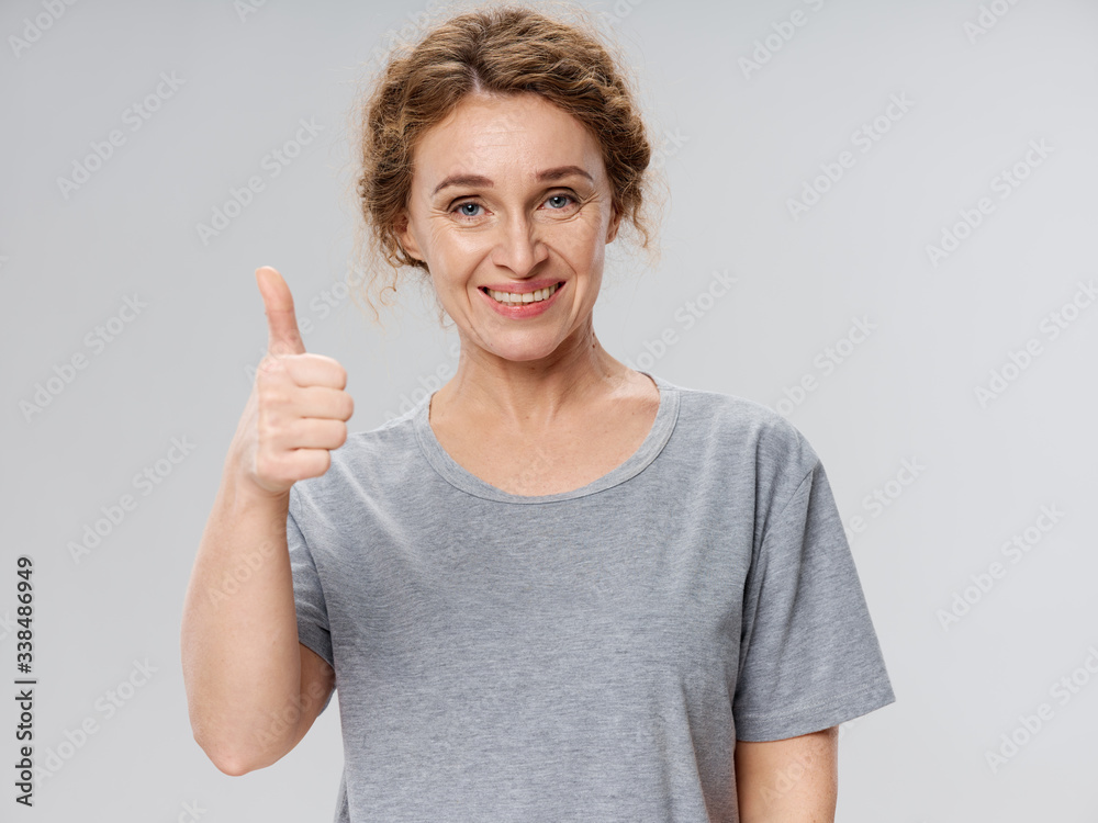 young man showing thumbs up young man showing thumbs up