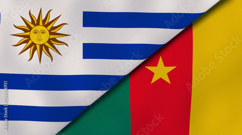 The flags of Uruguay and Cameroon. News, reportage, business background. 3d illustration photo