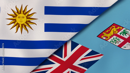 The flags of Uruguay and Fiji. News, reportage, business background. 3d illustration photo