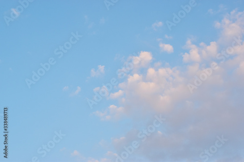 blue sky background with tiny clouds. Evening sky clouds.