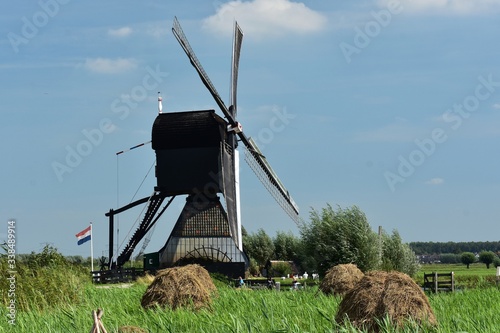 Windmill at Kinderdijk.
Kinderdijk is a village in the municipality of Molenlanden, in the province of South Holland, Netherlands. photo