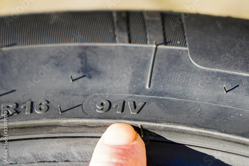 the speed and load index markings on the sidewall of the tire photo