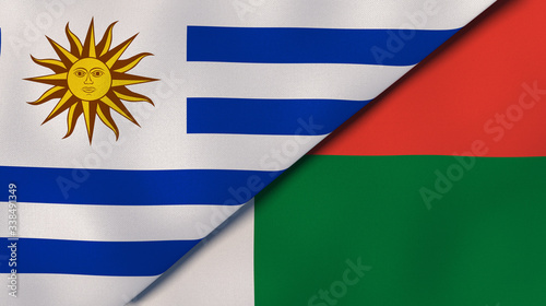 The flags of Uruguay and Madagascar. News, reportage, business background. 3d illustration photo