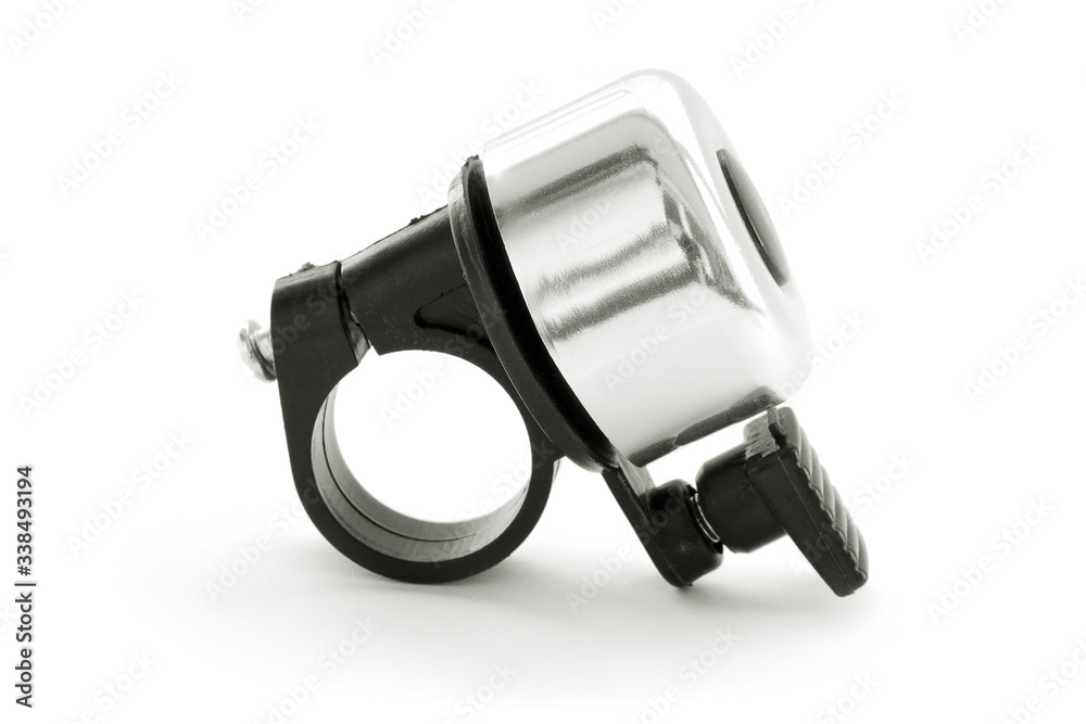 Silver-black bicycle bell isolated on a white background. Bicycle bell, plastic nozzle with metal ring part with shadow. Bicycle bell on a white background with shadow. Silver-black bicycle bell isolated on a white background. Bicycle bell, plastic nozzle with metal ring part with shadow. Bicycle bell on a white background with shadow.