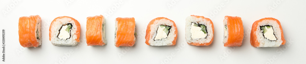 Flat lay with sushi rolls on white background. Japanese food Flat lay with sushi rolls on white background. Japanese food