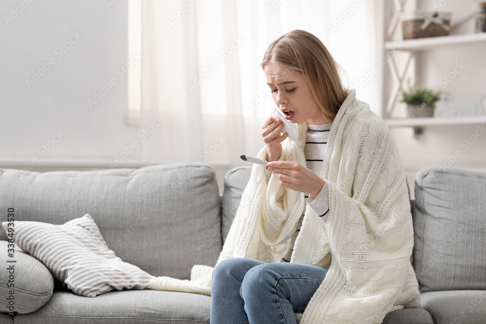 Covid-19 infected woman with fever coughing at home Covid-19 infected woman with fever coughing at home