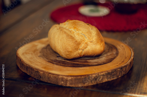 Breakfast table wood with coffee cups and hot bread.