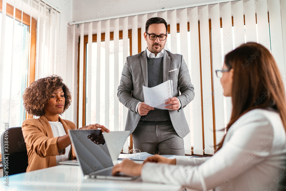 business-coworkers-working-together-at-the-meeting-stock-photo-adobe