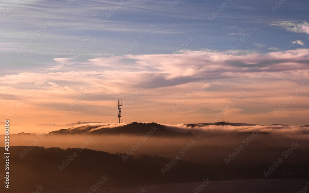 Sutro Tower at golden hour with rolling fog at sunrise, Marin County, CA, USA, November 4, 2018 Sutro Tower at golden hour with rolling fog at sunrise, Marin County, CA, USA, November 4, 2018