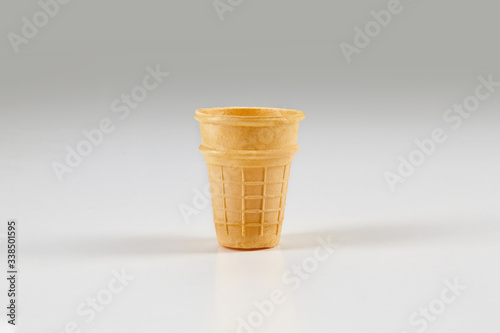 Canvas Print Empty, toasty wafer cup for ice cream isolated on white