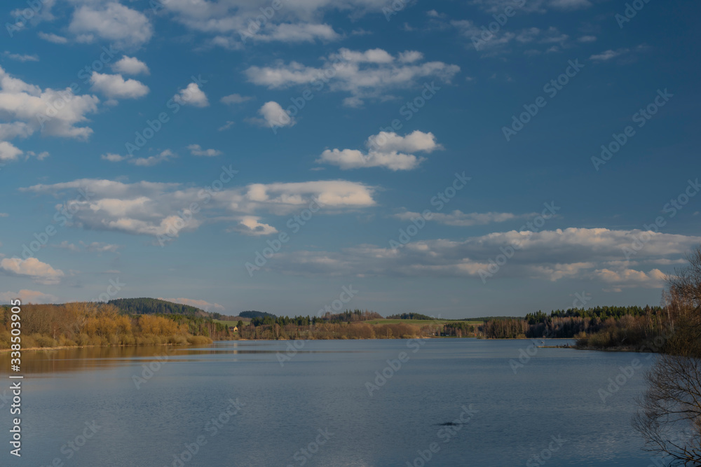 End of Lipno dam with dry grass in dry spring sunny day