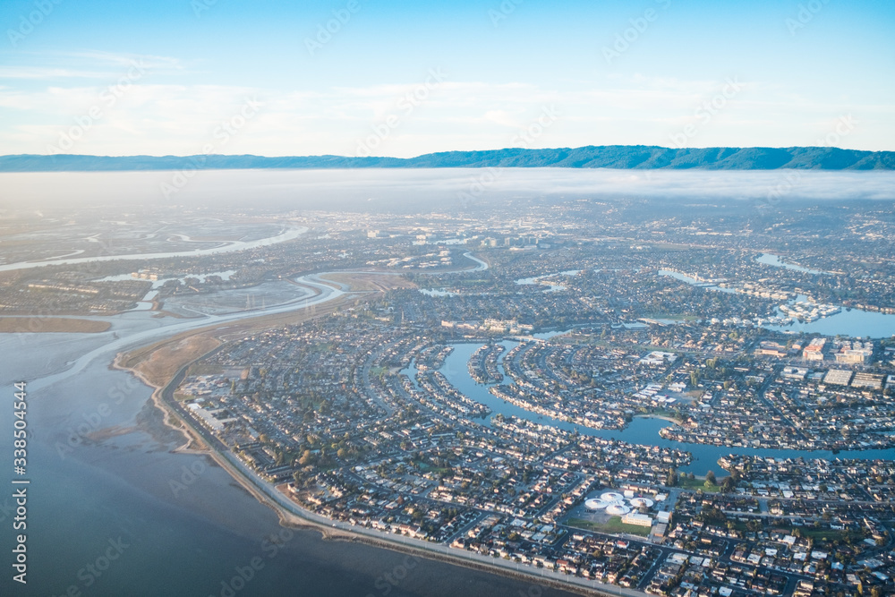 Ring neighborhood with inlet, San Mateo area,  typical Neighborhood, hills in background, fog, San Mateo, CA, USA, September 24, 2018