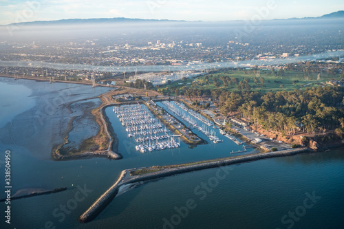 Photography Marina with boats docked full, San Mateo area, typical Neighborhood, hills in ba